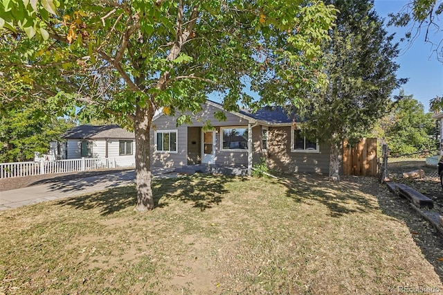 ranch-style home with a front yard