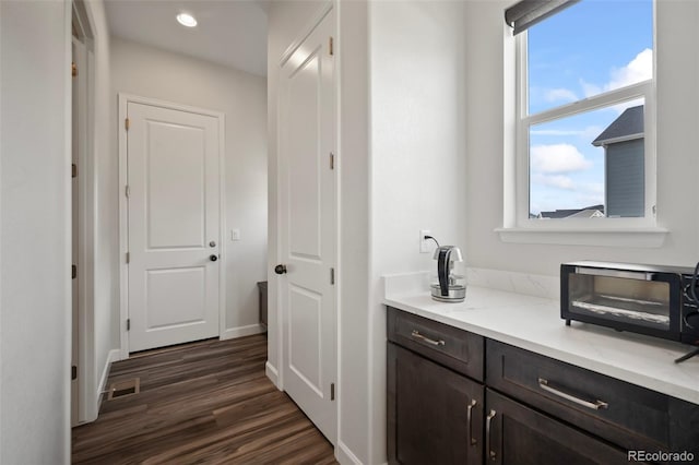 interior space with recessed lighting, dark wood finished floors, and visible vents