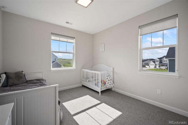bedroom with carpet floors and baseboards