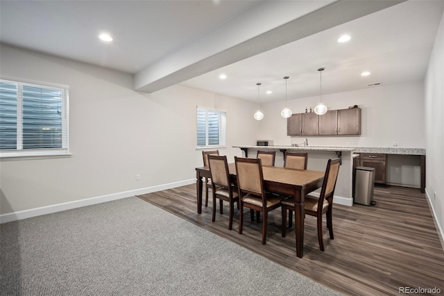 dining space featuring dark wood-style flooring, recessed lighting, and baseboards