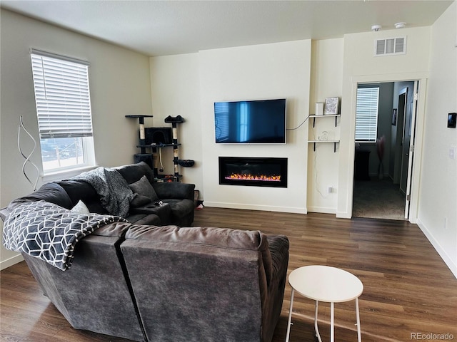 living room with dark hardwood / wood-style flooring