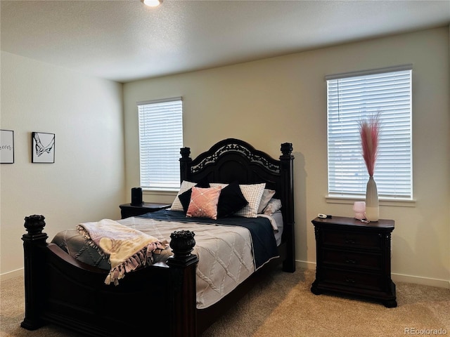 bedroom with light carpet