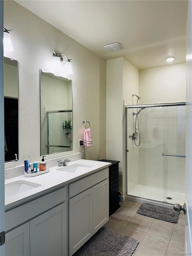 bathroom with walk in shower and vanity