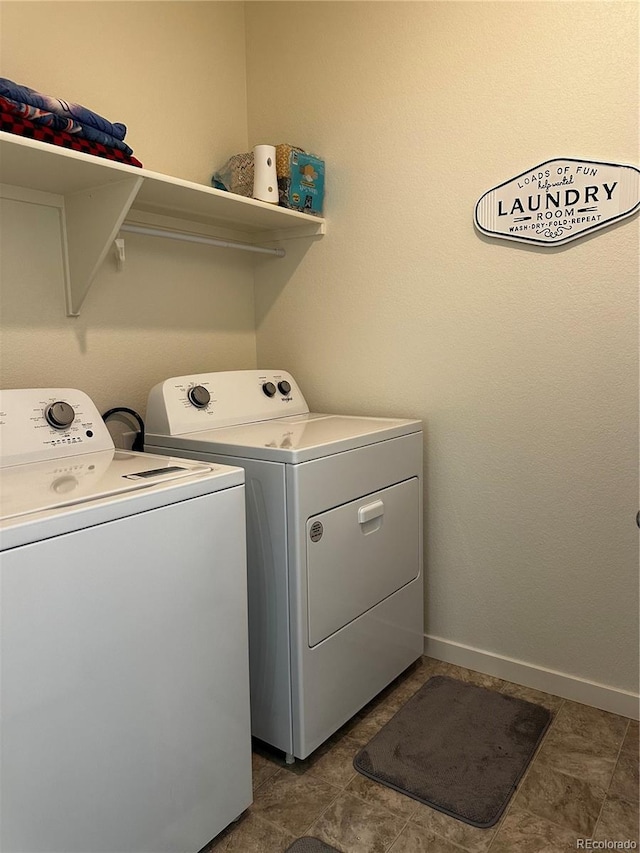 clothes washing area with washer and dryer