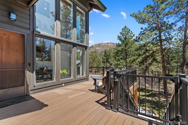 wooden deck with a mountain view