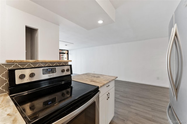 2 Adams St Unit 608, Denver, CO 80206 - kitchen with stainless steel appliances, light countertops, white cabinets, and light wood finished floors
