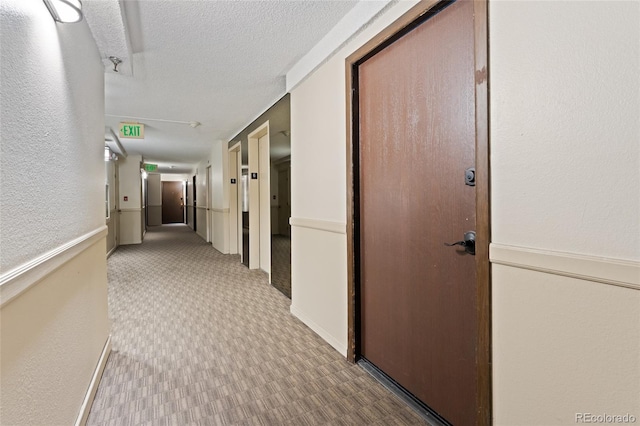 2 Adams St Unit 608, Denver, CO 80206 - hallway featuring a textured ceiling