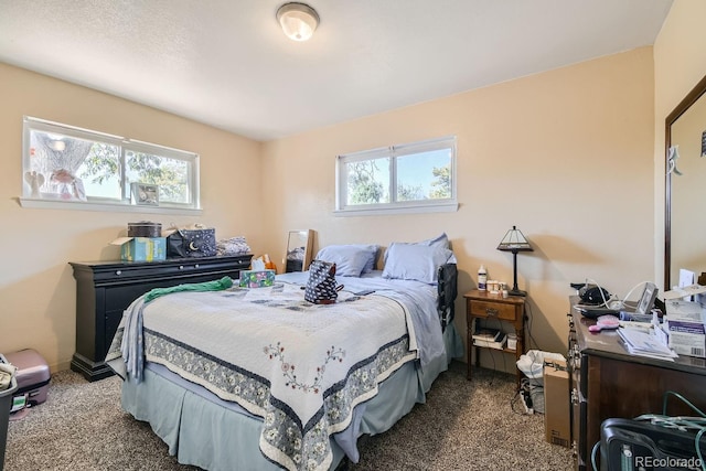 carpeted bedroom featuring multiple windows