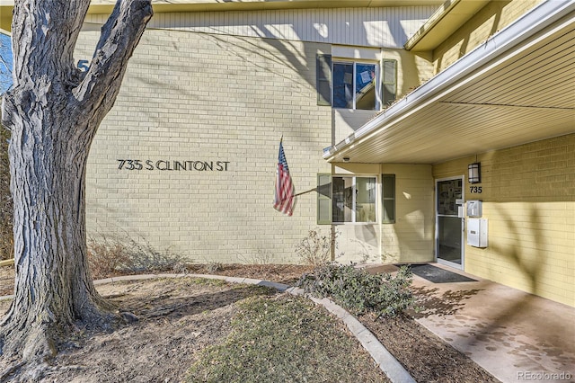 735 S Clinton St Unit 5B, Denver, CO 80247 - doorway to property with brick siding