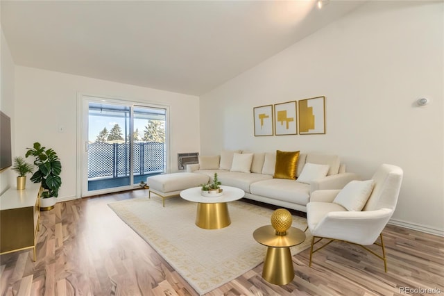 735 S Clinton St Unit 5B, Denver, CO 80247 - living area featuring lofted ceiling and wood finished floors