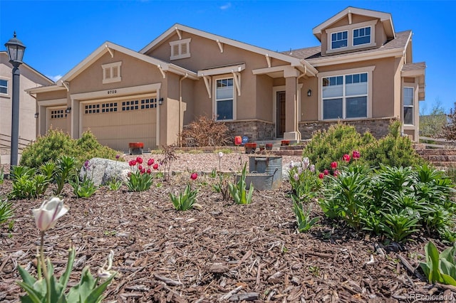 9709 Rockingham Dr, Peyton, CO 80831 - view of front of property featuring an attached garage, stucco siding, stone siding, and roof with shingles