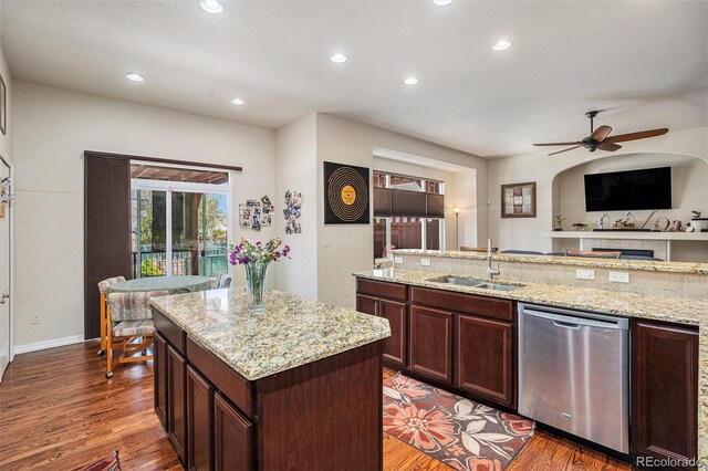 9709 Rockingham Dr, Peyton, CO 80831 - kitchen with dishwasher, a sink, a center island, recessed lighting, and ceiling fan
