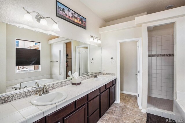 9709 Rockingham Dr, Peyton, CO 80831 - bathroom featuring a bath, double vanity, and a tile shower