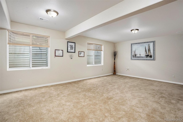 9709 Rockingham Dr, Peyton, CO 80831 - unfurnished room featuring carpet flooring, baseboards, and beam ceiling