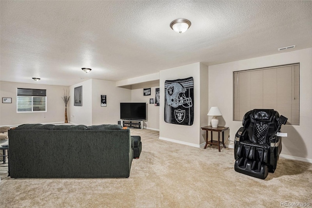 9709 Rockingham Dr, Peyton, CO 80831 - carpeted living room featuring a textured ceiling and baseboards