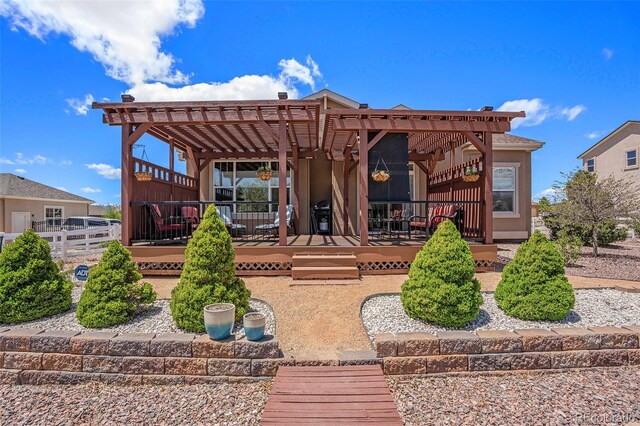 9709 Rockingham Dr, Peyton, CO 80831 - rear view of property with a pergola and a wooden deck