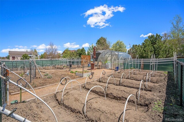 9709 Rockingham Dr, Peyton, CO 80831 - view of yard with a garden, an exterior structure, and an outbuilding