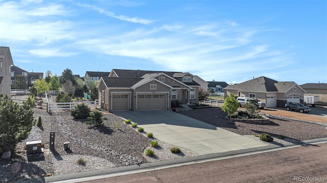 9709 Rockingham Dr, Peyton, CO 80831 - view of front of house featuring a residential view, an attached garage, and driveway