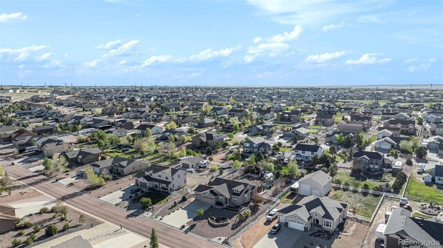 9709 Rockingham Dr, Peyton, CO 80831 - aerial overview of property's location featuring nearby suburban area