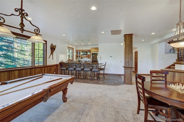 game room with light colored carpet and a textured ceiling