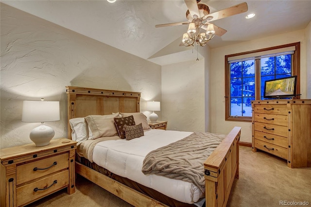 bedroom featuring vaulted ceiling, light colored carpet, and ceiling fan