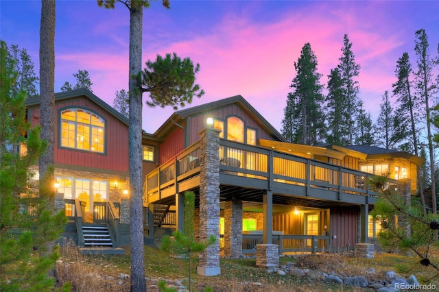 view of back house at dusk