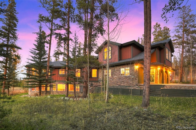 view of back house at dusk