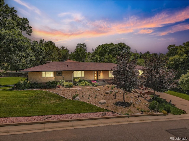 9650 W 35th Ave, Wheat Ridge, CO 80033 - view of front of house with a front yard and brick siding