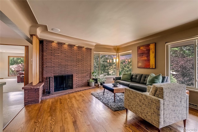 9650 W 35th Ave, Wheat Ridge, CO 80033 - living room featuring a fireplace and wood finished floors