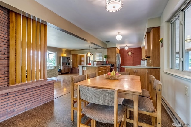 9650 W 35th Ave, Wheat Ridge, CO 80033 - dining room featuring a baseboard radiator