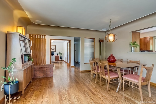 9650 W 35th Ave, Wheat Ridge, CO 80033 - dining area featuring light wood-style flooring and baseboards