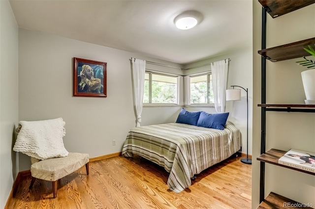 9650 W 35th Ave, Wheat Ridge, CO 80033 - bedroom with light wood-type flooring and baseboards