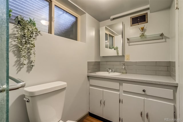 9650 W 35th Ave, Wheat Ridge, CO 80033 - bathroom featuring tasteful backsplash and vanity