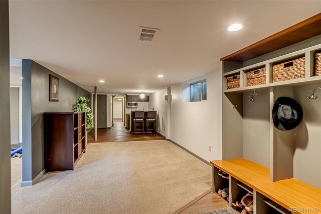 9650 W 35th Ave, Wheat Ridge, CO 80033 - mudroom featuring carpet, recessed lighting, and wood finished floors