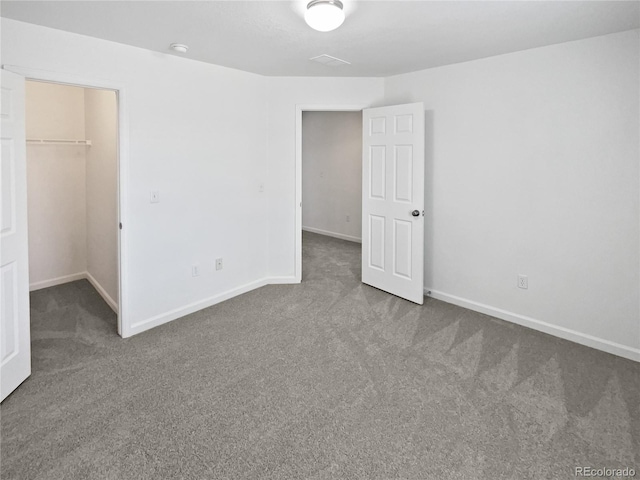 23559 Branston Ln, Parker, CO 80138 - unfurnished bedroom with baseboards, carpet flooring, and a spacious closet