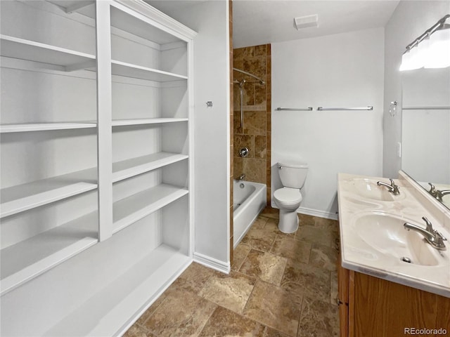 23559 Branston Ln, Parker, CO 80138 - full bath with baseboards, a sink, stone finish floor, and toilet