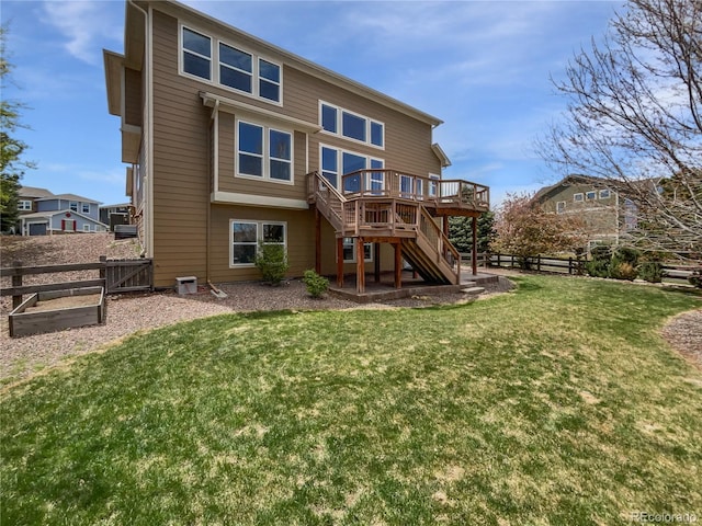 23559 Branston Ln, Parker, CO 80138 - back of house featuring stairs, a fenced backyard, a lawn, and a deck