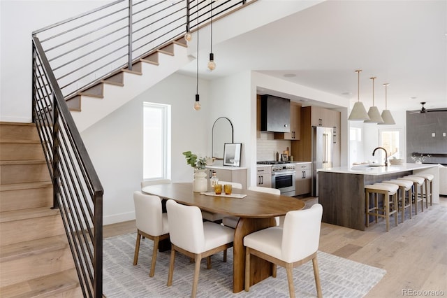 dining space with light hardwood / wood-style floors