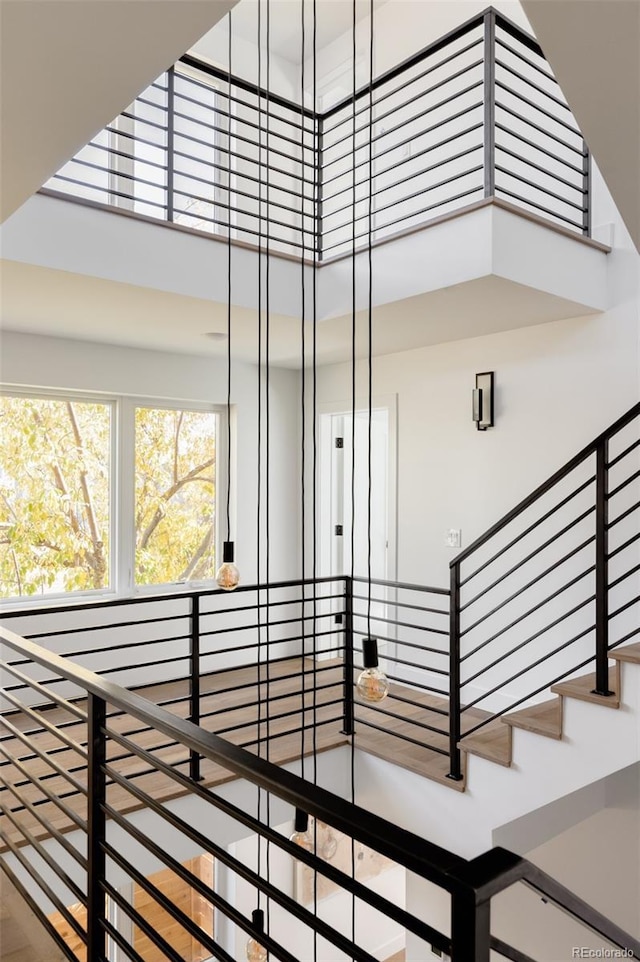 stairs featuring a high ceiling