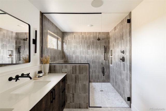 bathroom with vanity and an enclosed shower