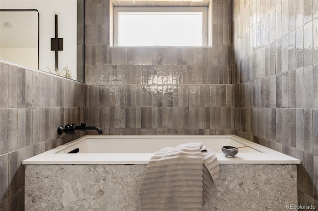 bathroom with tile walls