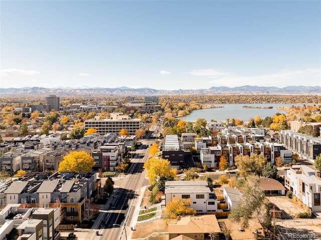 aerial view featuring a water and mountain view