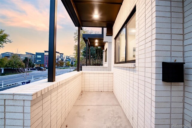 view of balcony at dusk