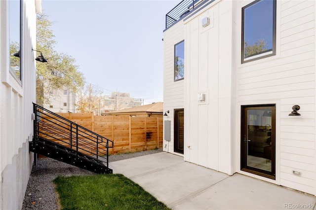 doorway to property featuring a patio area