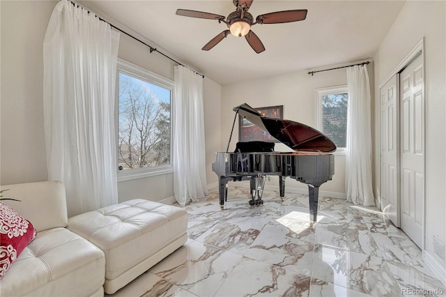 3035 Blodgett Dr, Colorado Springs, CO 80919 - sitting room featuring baseboards, a ceiling fan, and marble finish floor