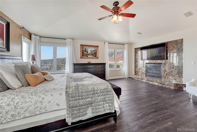3035 Blodgett Dr, Colorado Springs, CO 80919 - bedroom with baseboards, ceiling fan, wood finished floors, a premium fireplace, and lofted ceiling