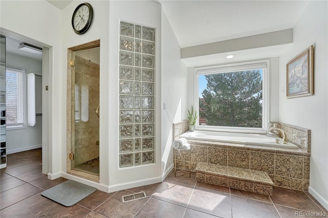 3035 Blodgett Dr, Colorado Springs, CO 80919 - full bathroom with visible vents, a bath, baseboards, tile patterned flooring, and a stall shower