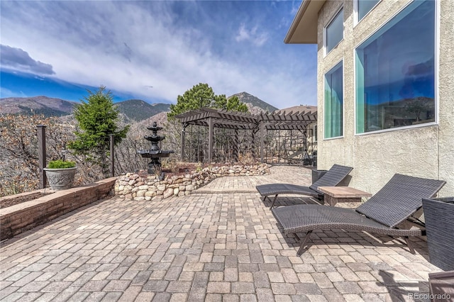 3035 Blodgett Dr, Colorado Springs, CO 80919 - view of patio / terrace with a mountain view, cooling unit, a pergola, and fence