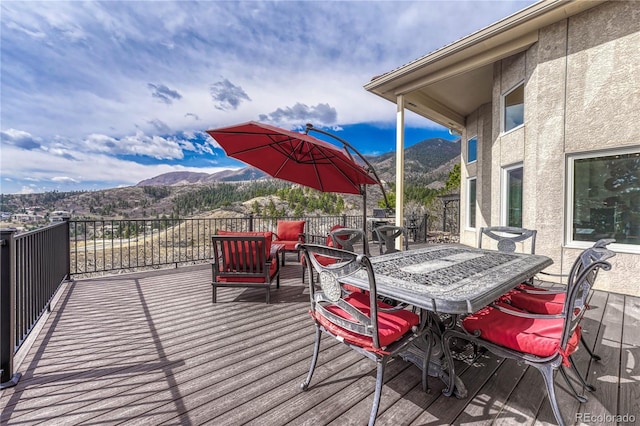 3035 Blodgett Dr, Colorado Springs, CO 80919 - deck featuring outdoor dining area and a mountain view