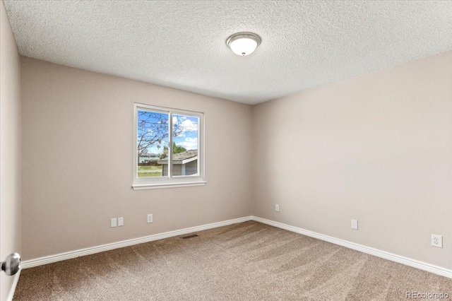 13244 Quivas St, Denver, CO 80234 - carpeted empty room with baseboards and a textured ceiling